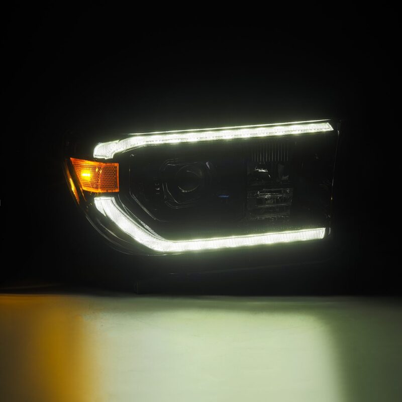 Load image into Gallery viewer, AlphaRex 07-13 Toyota Tundra / 08-17 Sequoia LUXX LED Proj HL Alpha-Blk w/Actv Light Seq. Sig + DRL
