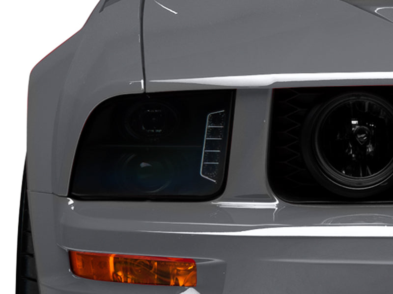 Load image into Gallery viewer, Raxiom 05-09 Ford Mustang w/ Halogen LED Halo Prjctr Headlights-Blk Hsng(Smoked Lens Exclude GT500)
