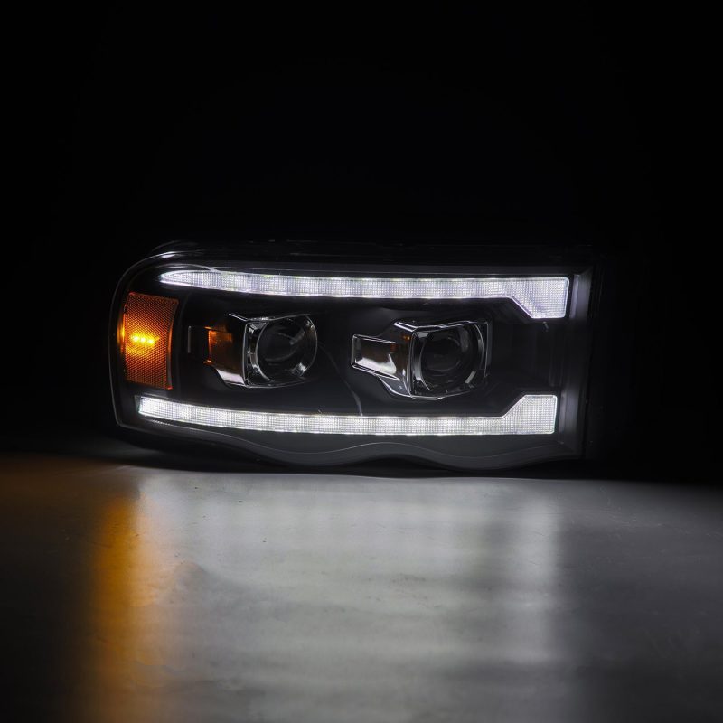Load image into Gallery viewer, AlphaRex 02-05 Dodge Ram 1500 LUXX LED Proj Headlights Plank Style Black w/Activ Light/Seq Signal
