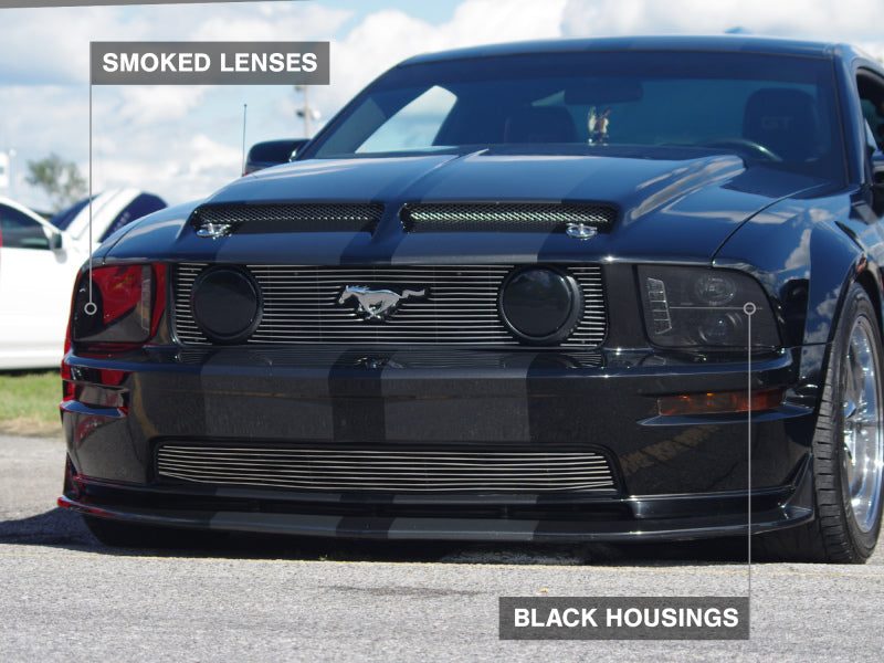 Load image into Gallery viewer, Raxiom 05-09 Ford Mustang w/ Halogen LED Halo Prjctr Headlights-Blk Hsng(Smoked Lens Exclude GT500)
