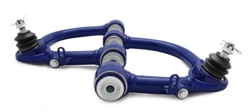 Load image into Gallery viewer, SuperPro Toyota Land Cruiser 100 Series Front Upper Fixed Offset Control Arm Set
