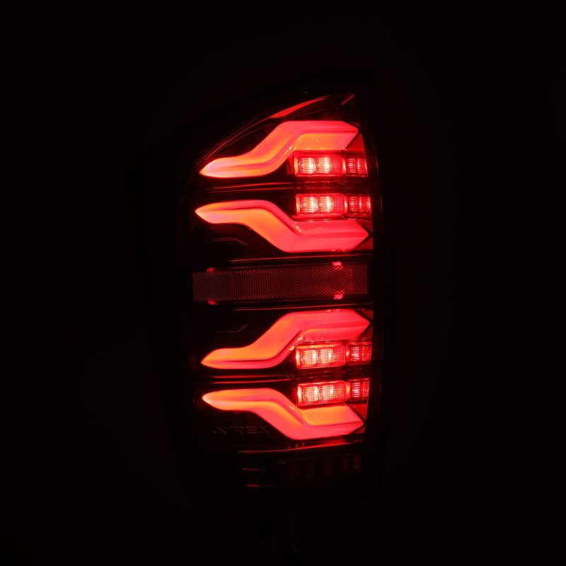 Load image into Gallery viewer, AlphaRex 16-21 Toyota Tacoma LUXX LED Taillights Alpha Blk w/Activ Light/Seq Signal
