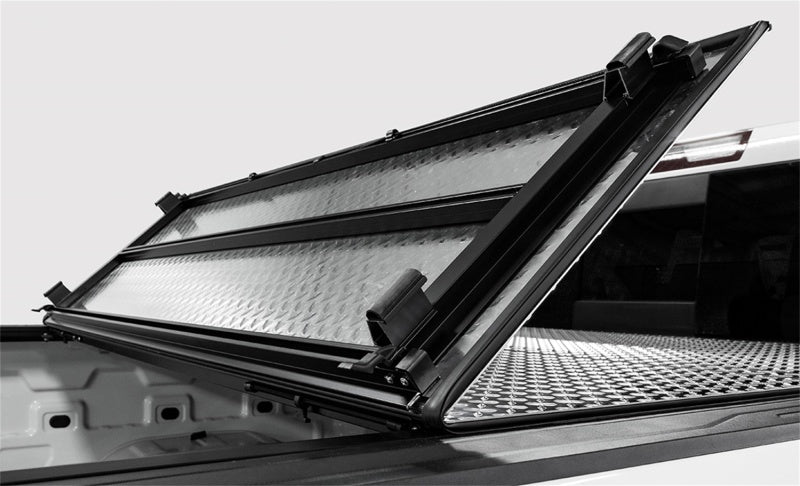 Load image into Gallery viewer, Access LOMAX Tri-Fold Cover Black Urethane Finish 20+ GM 2500/3500 - 6ft 8in Bed
