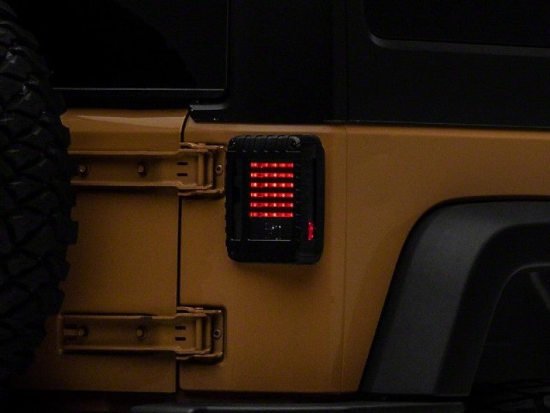Load image into Gallery viewer, Raxiom 07-18 Jeep Wrangler JK LED Tail Lights- Black Housing (Smoked Lens)
