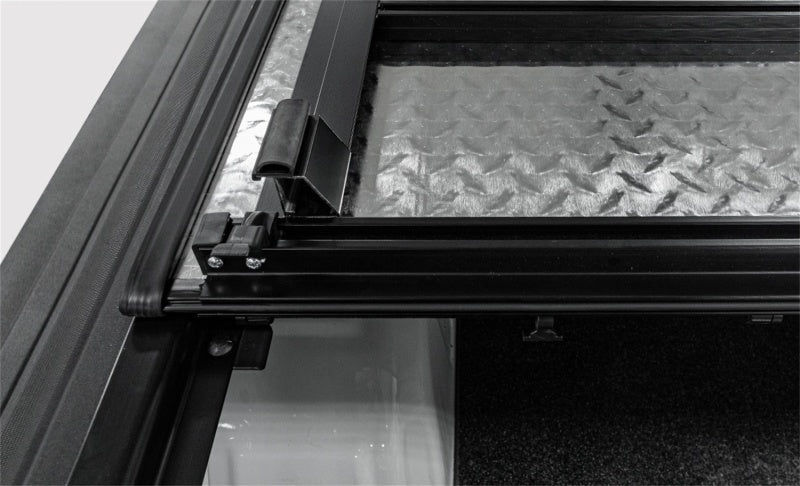 Load image into Gallery viewer, Access LOMAX Tri-Fold Cover Black Urethane Finish 20+ GM 2500/3500 - 6ft 8in Bed
