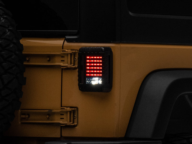 Load image into Gallery viewer, Raxiom 07-18 Jeep Wrangler JK LED Tail Lights- Black Housing (Smoked Lens)
