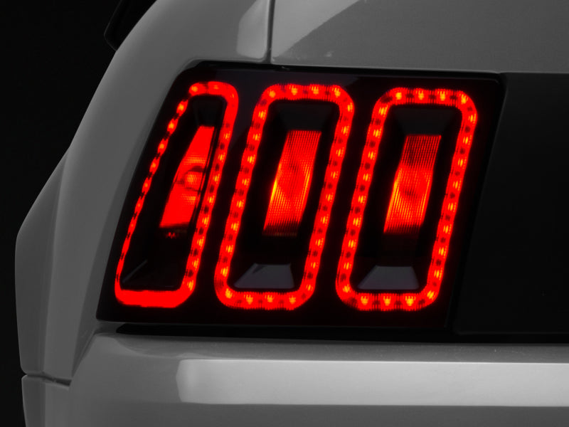 Load image into Gallery viewer, Raxiom 99-04 Ford Mustang Excluding 99-01 Cobra Icon LED Tail Lights- Black Housing (Smoked Lens)
