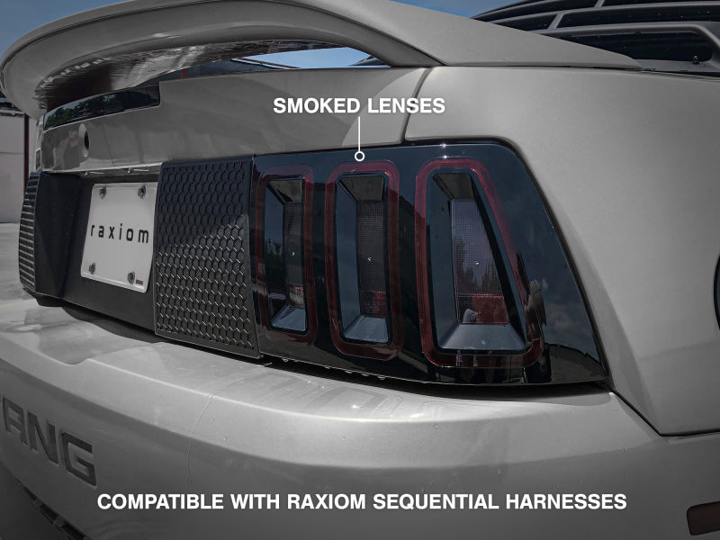 Load image into Gallery viewer, Raxiom 99-04 Ford Mustang Excluding 99-01 Cobra Icon LED Tail Lights- Black Housing (Smoked Lens)
