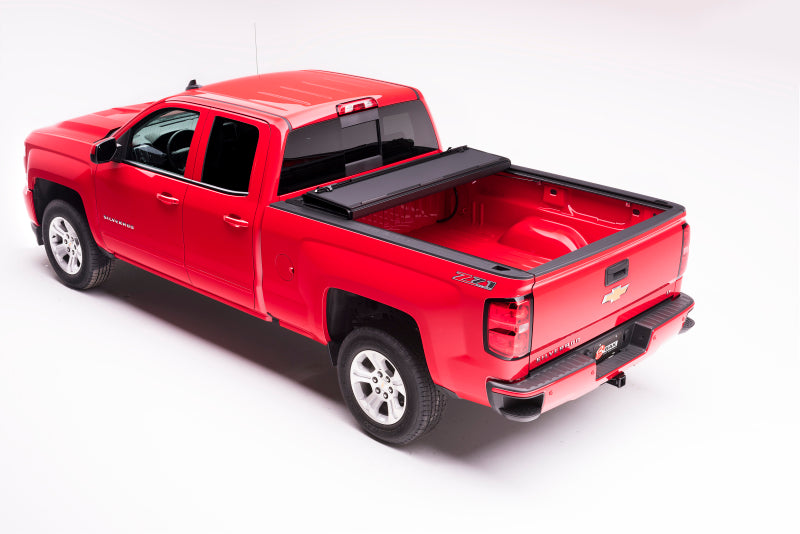 Load image into Gallery viewer, BAK 04-14 Chevy Silverado 1500 5ft 8in Bed BAKFlip MX4 Matte Finish

