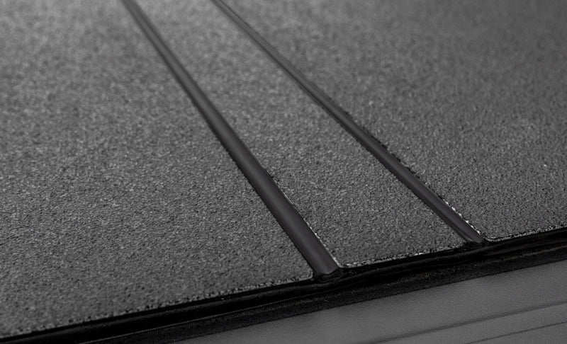 Load image into Gallery viewer, Access LOMAX Tri-Fold Cover Black Urethane Finish 20+ GM 2500/3500 - 6ft 8in Bed
