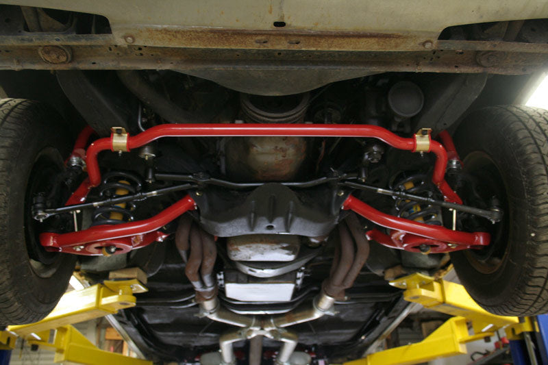 Load image into Gallery viewer, UMI Performance 64-72 GM A-Body 1-1/4in Solid Front Sway Bar - Black
